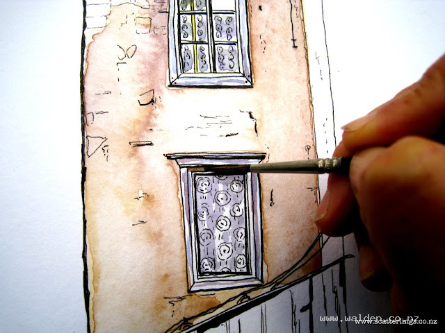 Painting the little details with a tiny brush