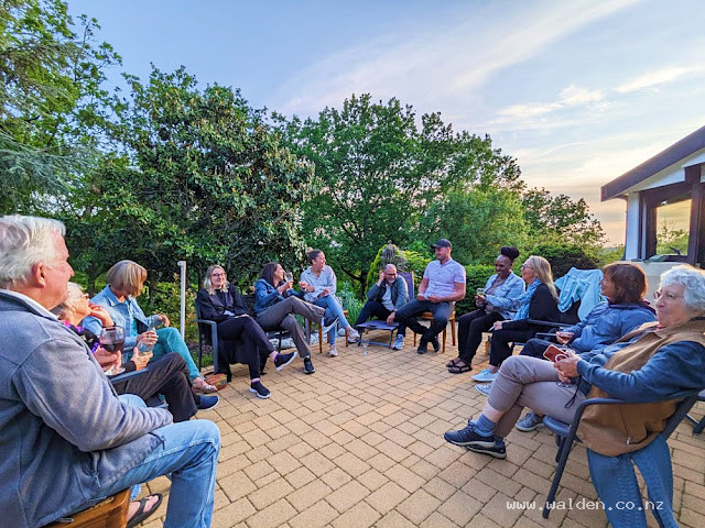 Chats over glasses of wine at golden hour, 2024