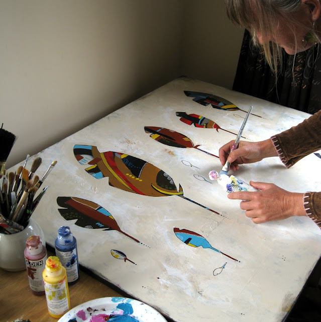 Painting out the background to isolate the feather shapes