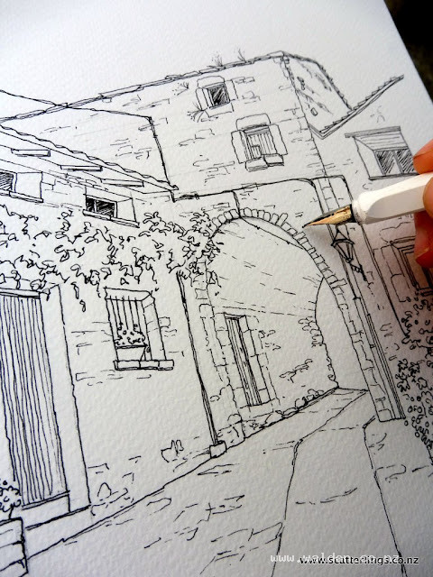 Inking in the drawing with a fine nib