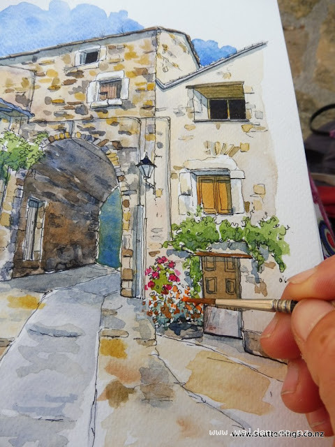 Painting in the tiny details with a small brush