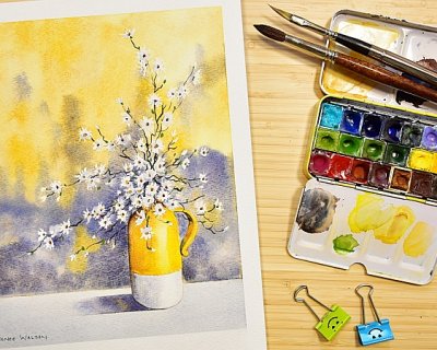a vase with white flowers